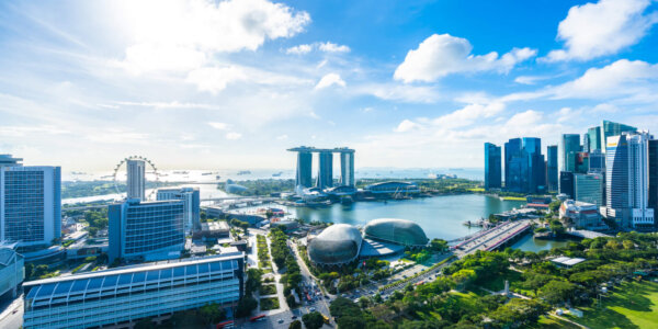 Beautiful architecture building exterior cityscape in Singapore city skyline with white cloud on blue sky